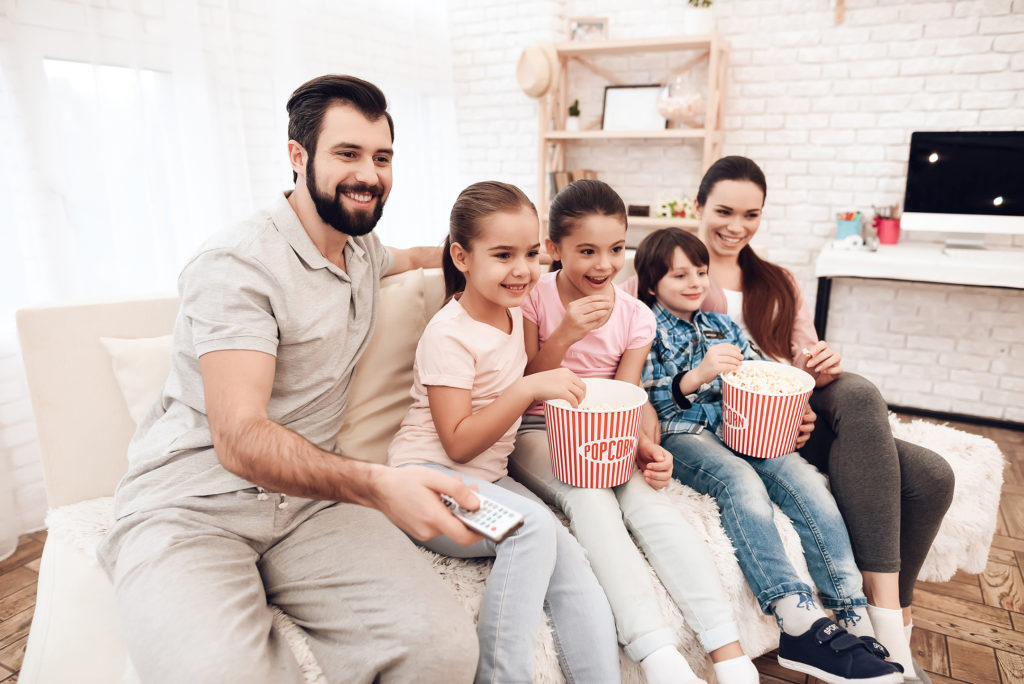 Family watching a film together