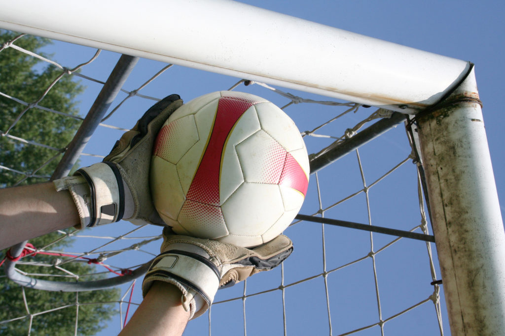 Goalkeeper Catching Football