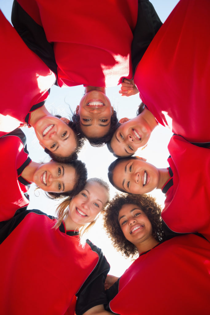 Women's Football Team Huddle