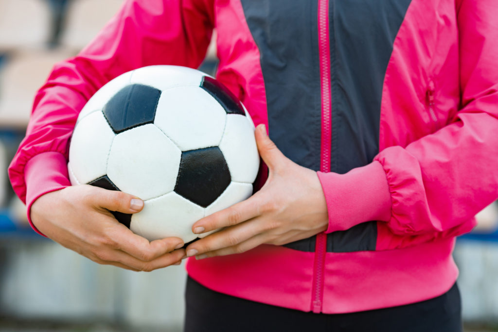 Woman holding a football