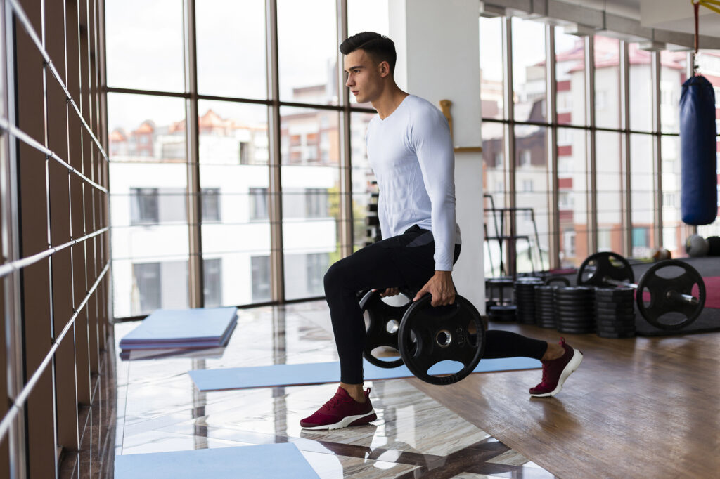 Man performing lunge with weights