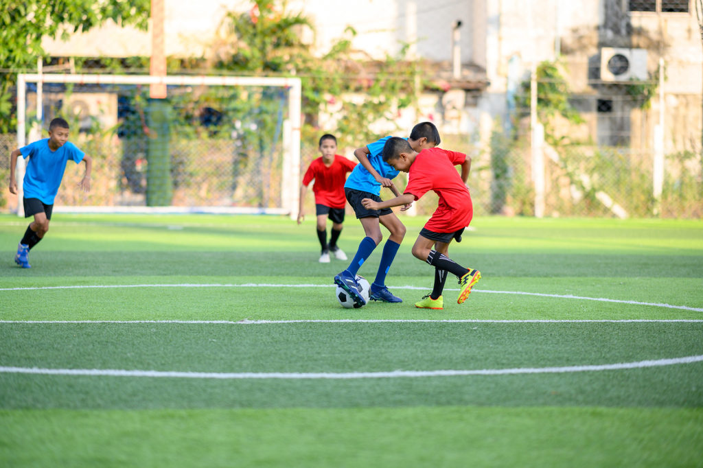 Children playing a football match