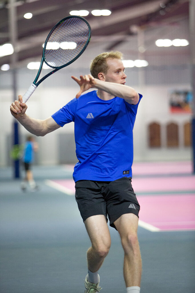 Best Tennis Shorts: A tennis player wearing the Activa t-shirt and shorts.