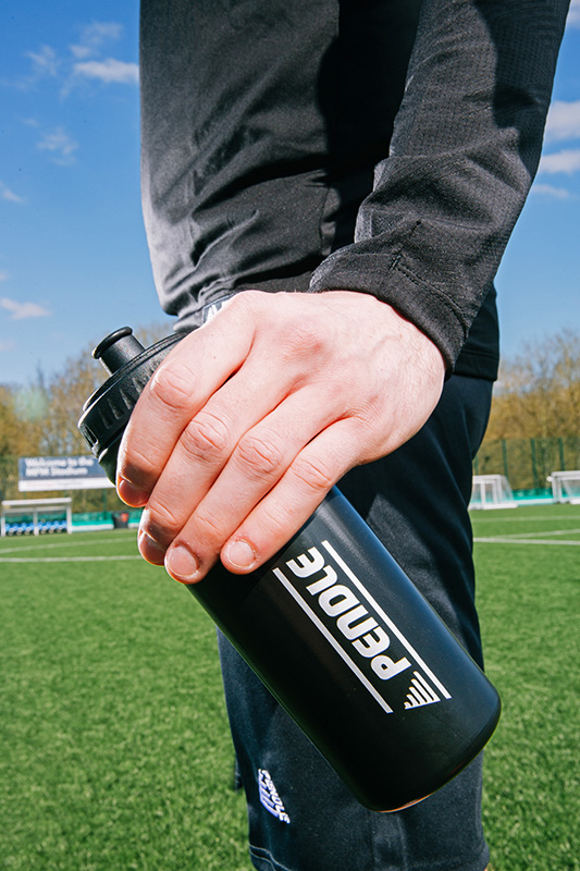 Football Player Holding Water Bottle