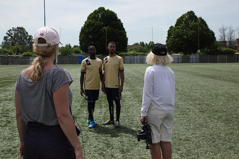 Director Cass Virdee on the set of Realness With A Twist with the film's two stars.