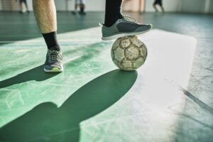 Close up of futsal player's feet and ball