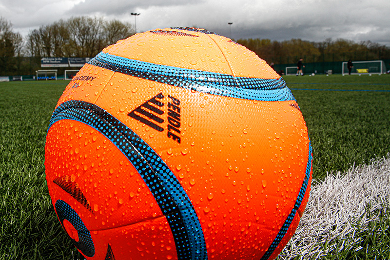 Football Training in the Rain - Football Covered in Rain Spots