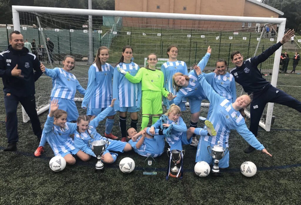 Team wearing Pendle Football Kit celebrating