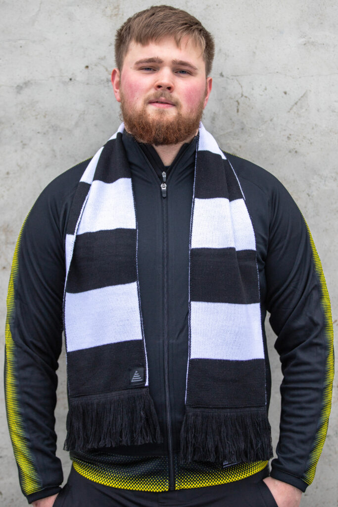 Football tracksuit styled with a football scarf