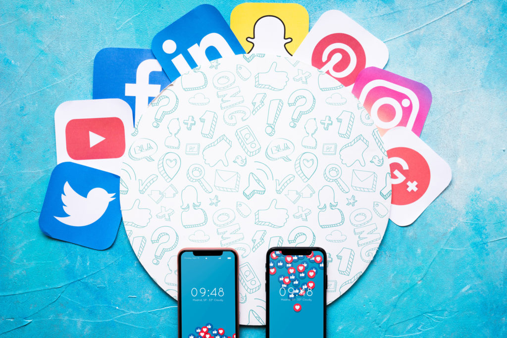 two phones and social media logos