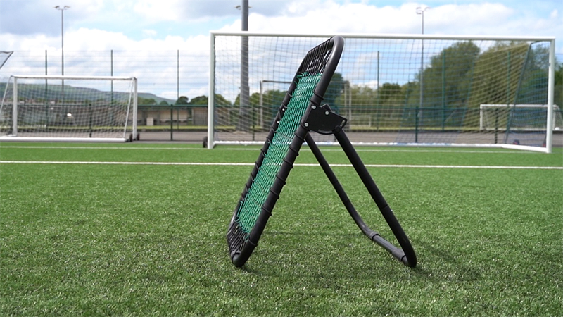 Football rebounder on a football pitch