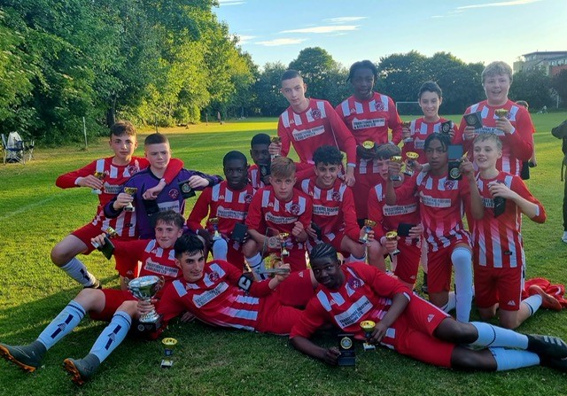 Redpath Albion with their football trophies