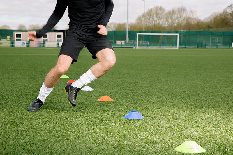 Football player working on speed and footwork