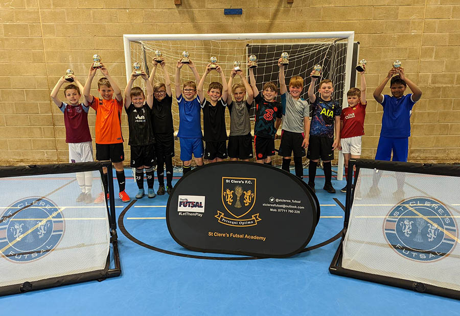 Trophy Presentation Night with children holding up their awards.