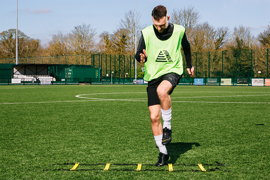 An agility ladder being used in football training