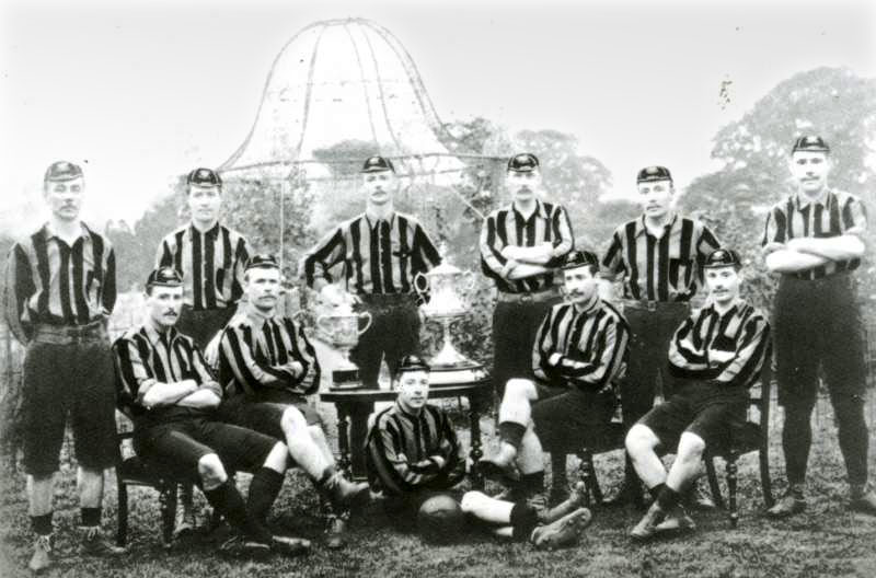 The Wolverhampton Wanderers team that won the FA Cup. The team poses with the trophy