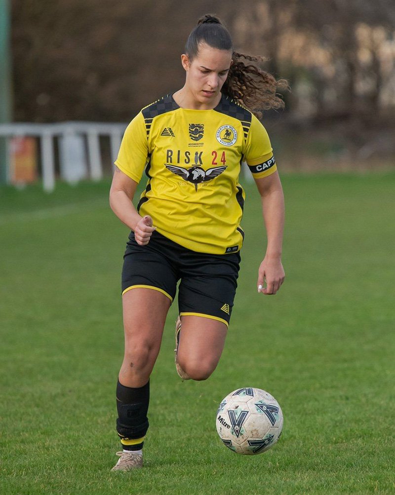 A Wyberton FC player wearing a Pendle kit with the England Football Accredited logo on the front