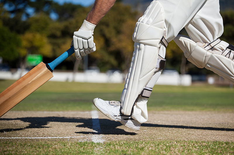 Cricketer Running on Field