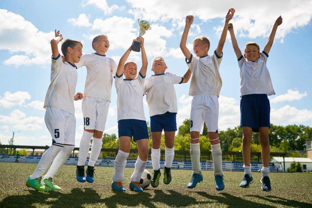 A youth football team celebrating