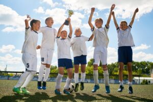 Youth football team celebrating a victory