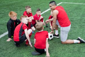 Junior Football Players Listening to a Pep Talk