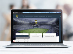 Football club website displaying on a laptop