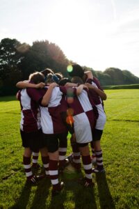 Football players in a huddle